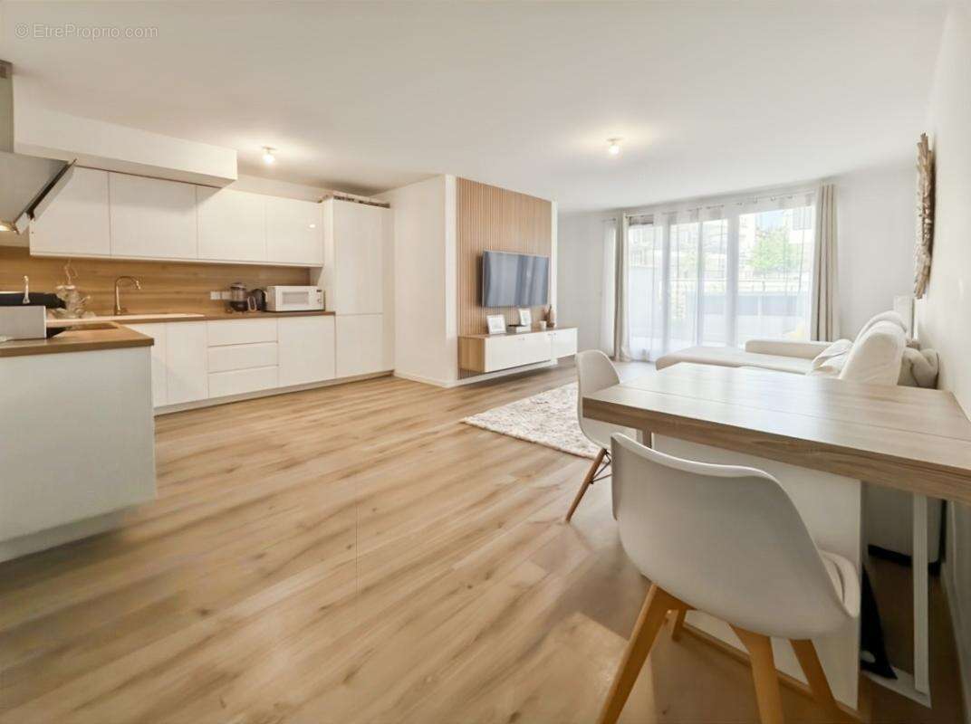 Appartement 3 pièces de 71 m2 avec jardin et 2 places de stationnement en sous-sol - photo 2
