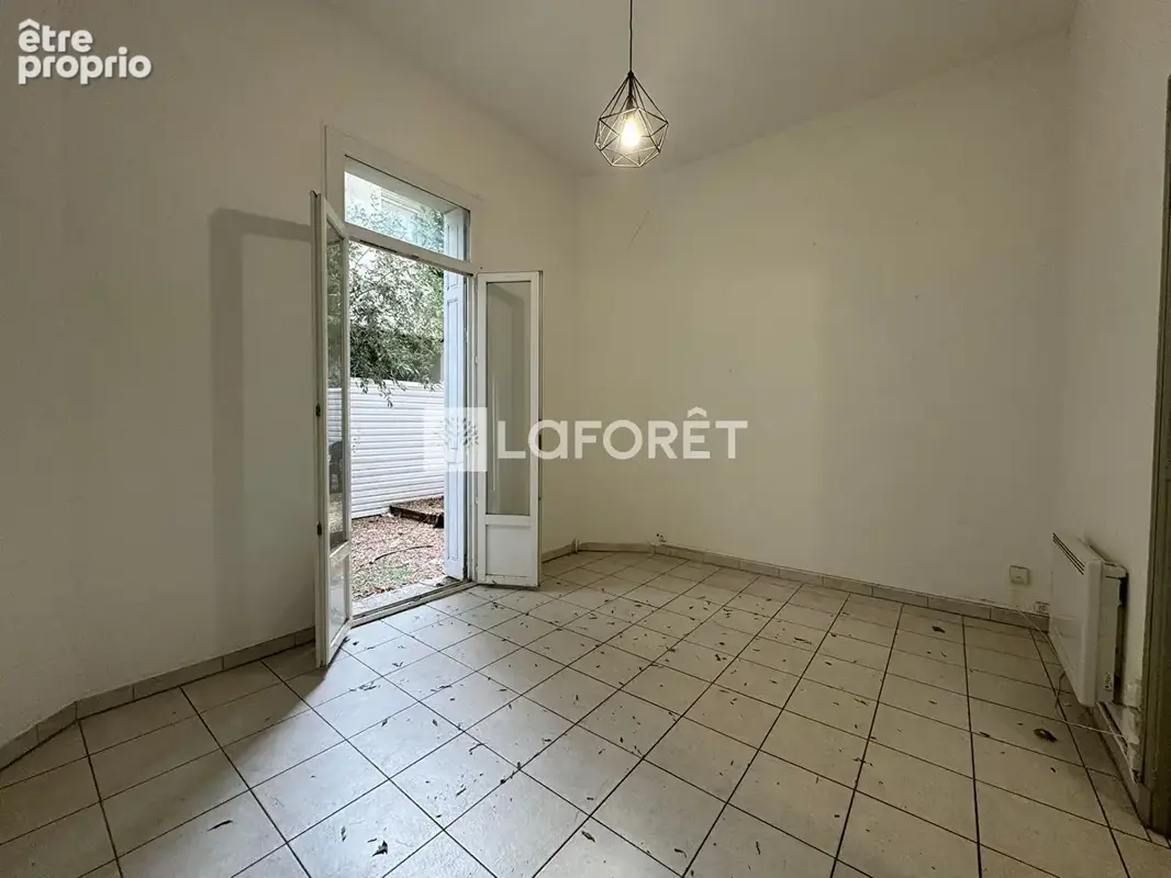 Appartement T2 rez-de-jardin centre ville - photo 2