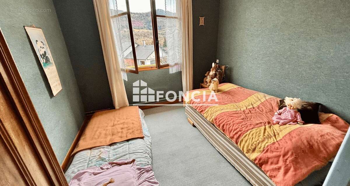MONTAGNOLE Maison esprit savoyarde sur 1 400 m2 de terrain arboré, bien exposée et vue dominante - photo 9
