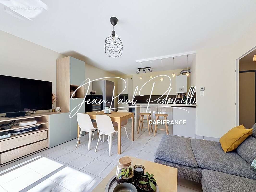 Tassin-la-Demi-Lune - Appartement 2 pièces de 48 m² avec balcon, parking privatif et cave - résidence sécurisée récente - photo 3