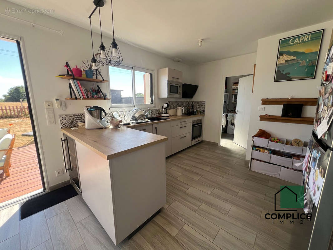 Maison 90 m² à Saint-Etienne-De-Montluc  - photo 7