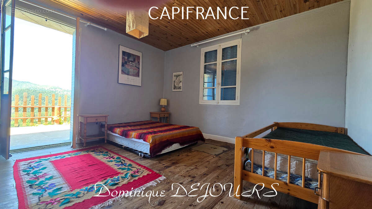 Nichée au cœur de la nature, sans vis-à-vis et avec une vue remarquable, grande maison de 7 (voir 8) chambres et de belles terra - photo 16