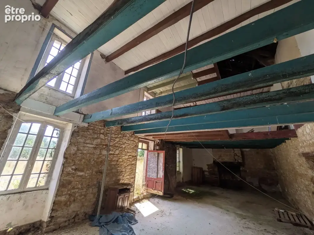Nostang propriété composée d'une maison en pierre à rénover avec trois dépendance un puits et 21 hectares environ - photo 12