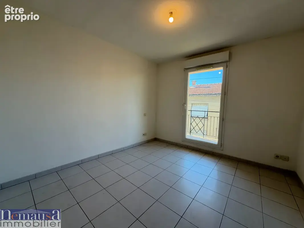NIMES- Appartement T2 avec place de parking et balcon - photo 5