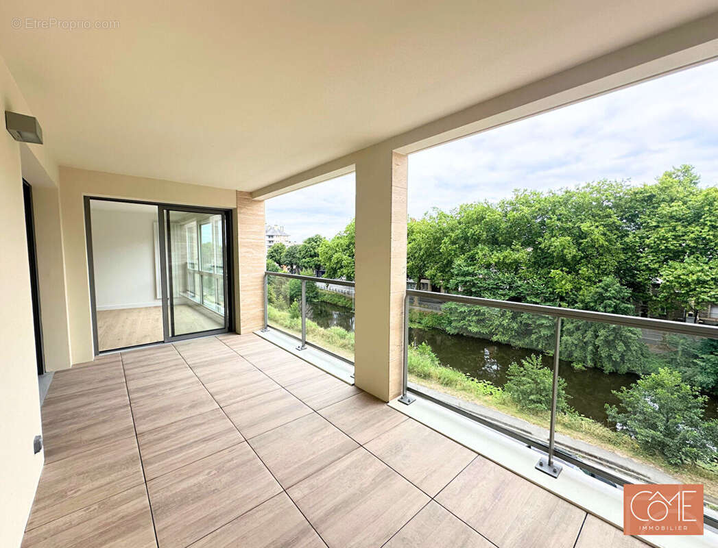 Grand type 3 neuf de standing - 12m² de terrasse - parking - vue canal de l'ille - anatole france - rennes - photo 4
