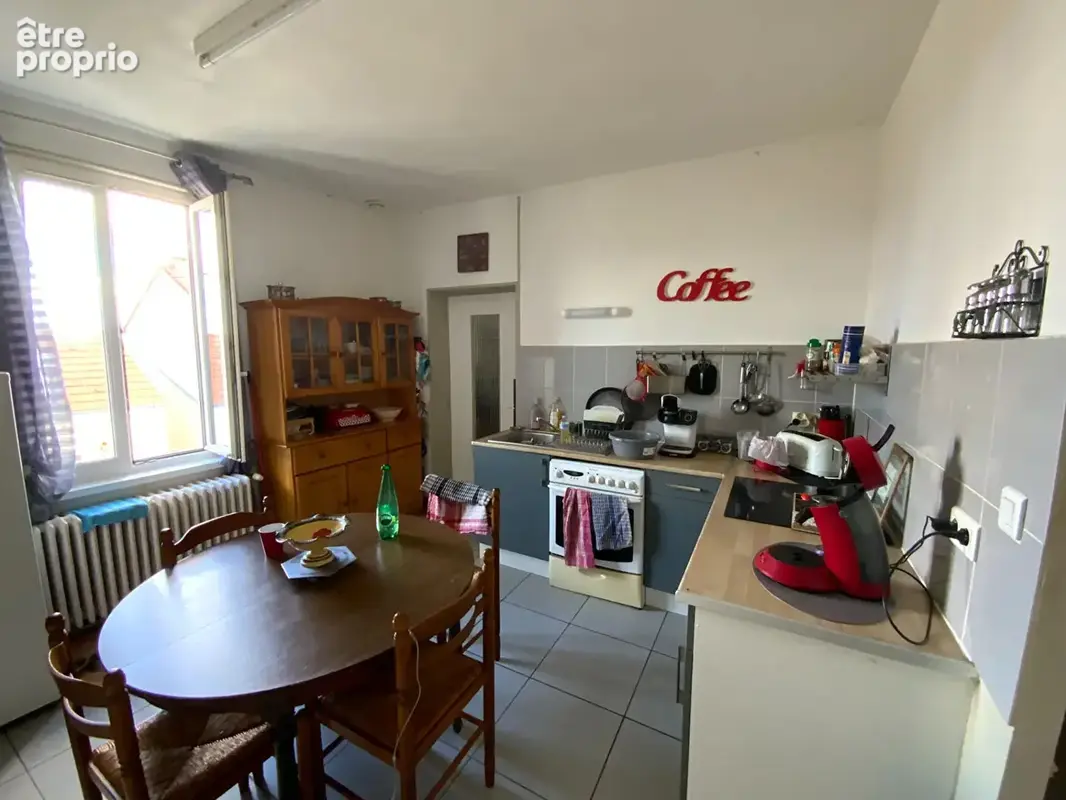 LE CREUSOT proche commodités. Immeuble comprenant deux appartements avec garage et dépendances - photo 2