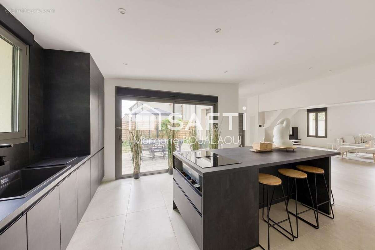 Photo 2 - Maison à LE PLESSIS-BOUCHARD