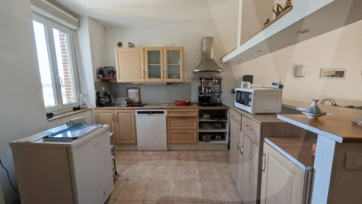 Appartement T2 de 51 m² avec dépendances et jardin - photo 2