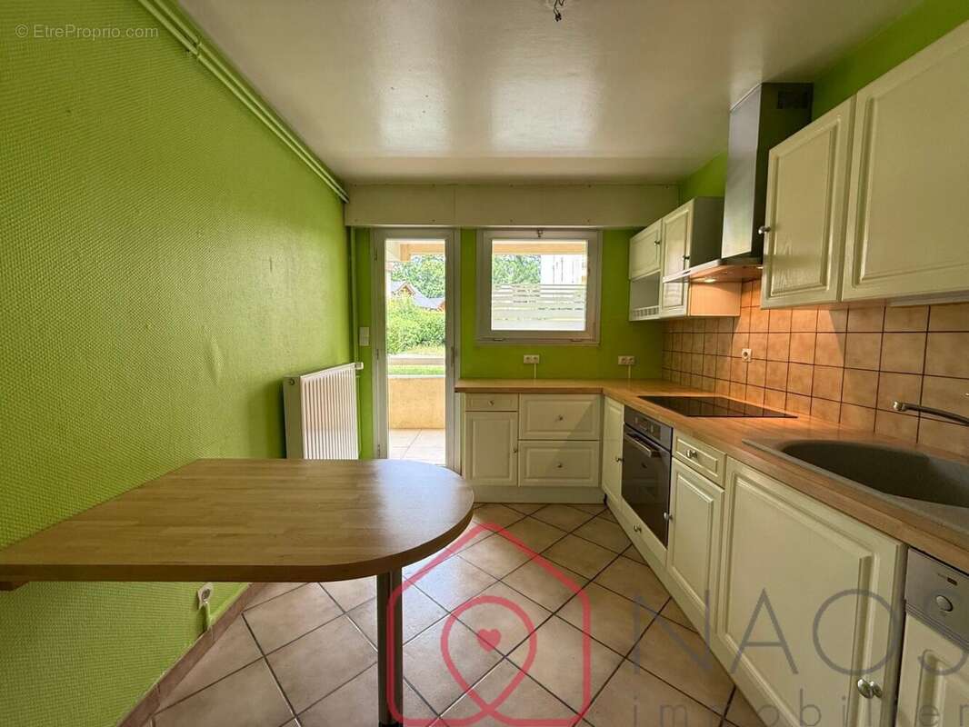 Appartement t2 en rez-de-chaussée avec balcon filant, cave et stationnements - photo 4