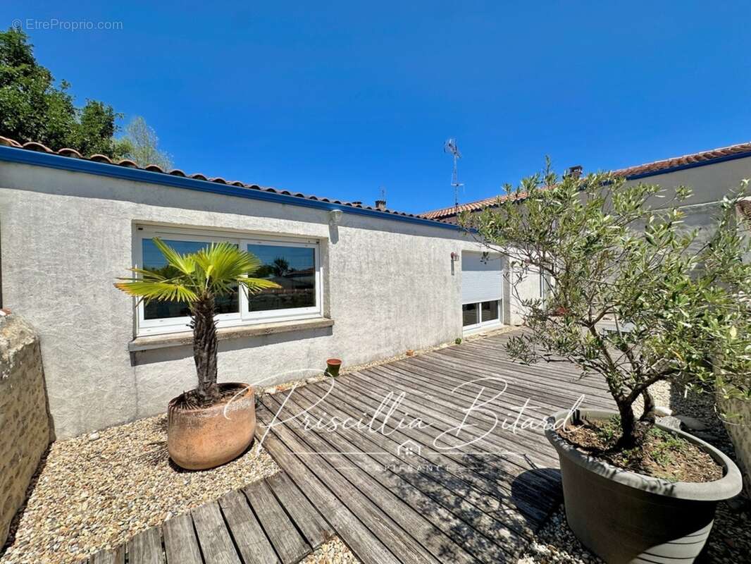 Le charme d'un environnement verdoyant allié au confort d'une maison familiale - photo 11
