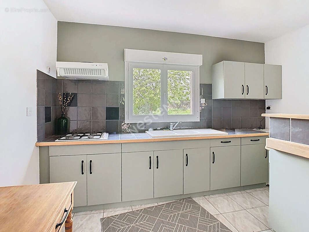Venez découvrir cette magnifique maison en pierres apparentes, nichée dans un écrin de verdure, à seulement 5 km de l'axe Nantes - photo 15
