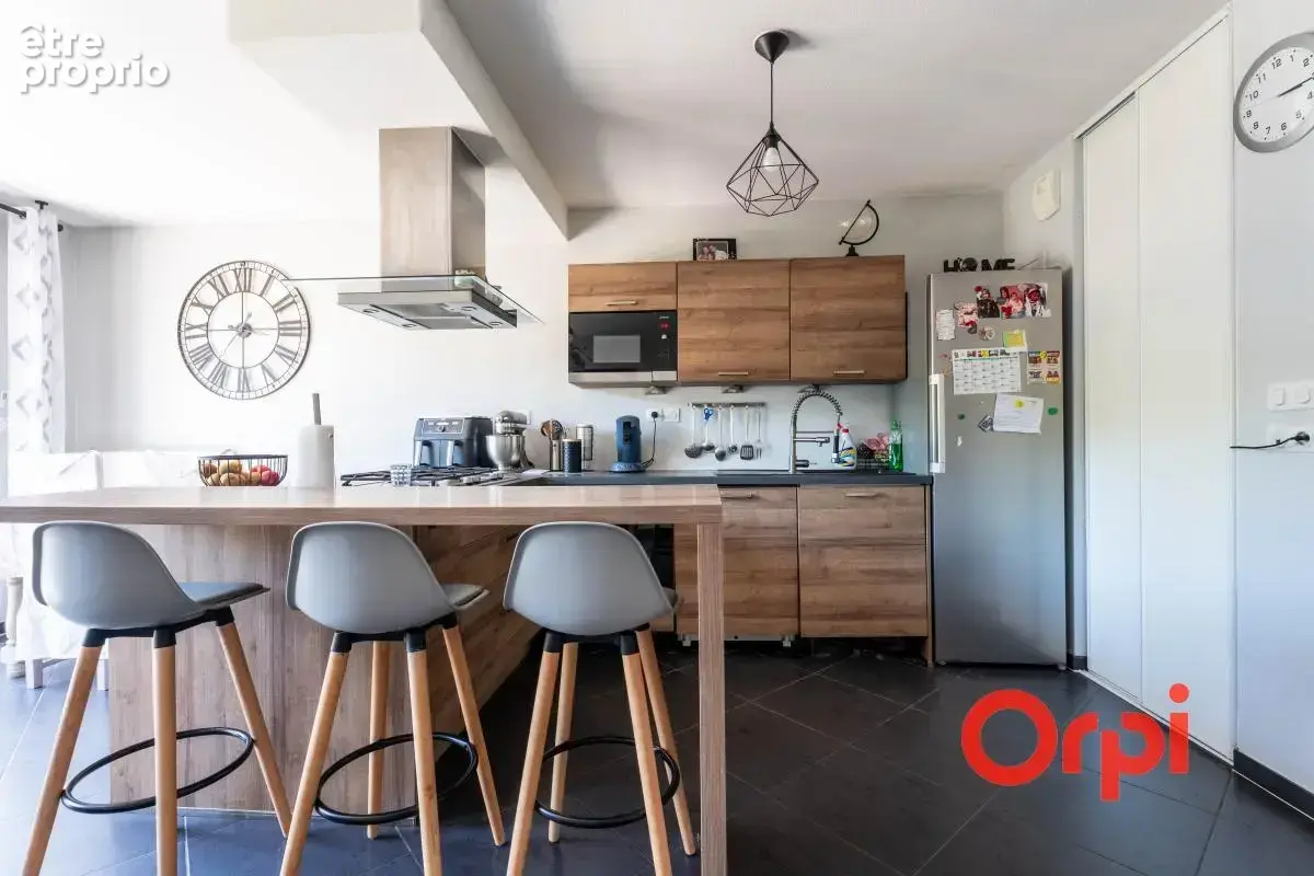 Appartement en rez-de-jardin avec un garage - photo 2