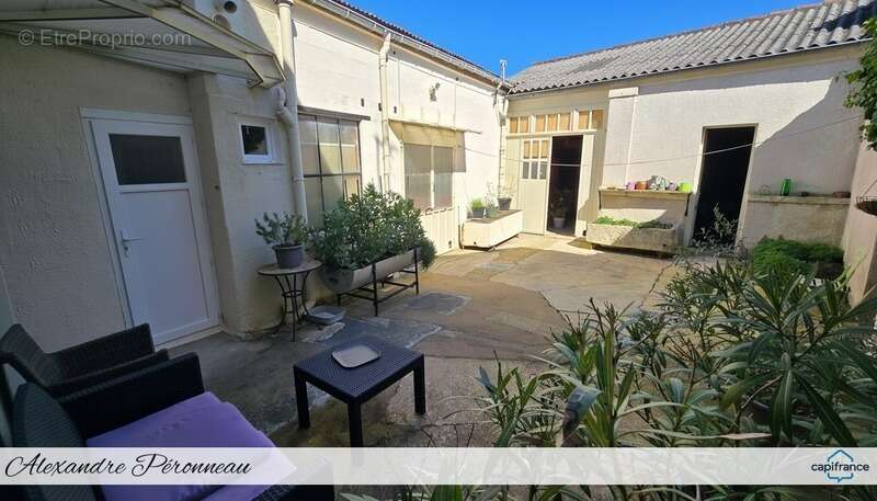  ensemble immobilier : maison 4 ch + garage atelier – idéal artisan ou projet mixte – secteur ferrieres - photo 2