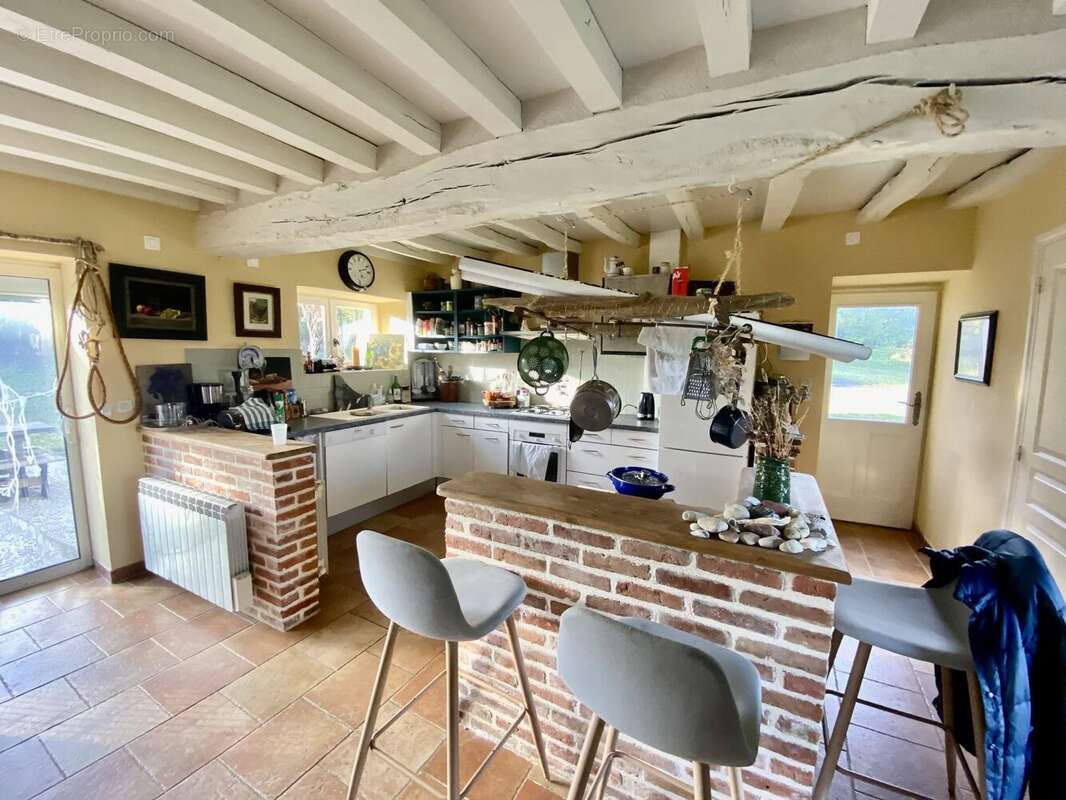 Maison à GINAI
