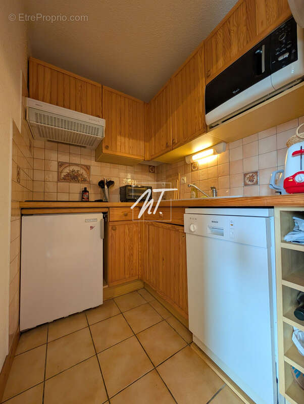 Appartement en rez de jardin à proximité du village - photo 7