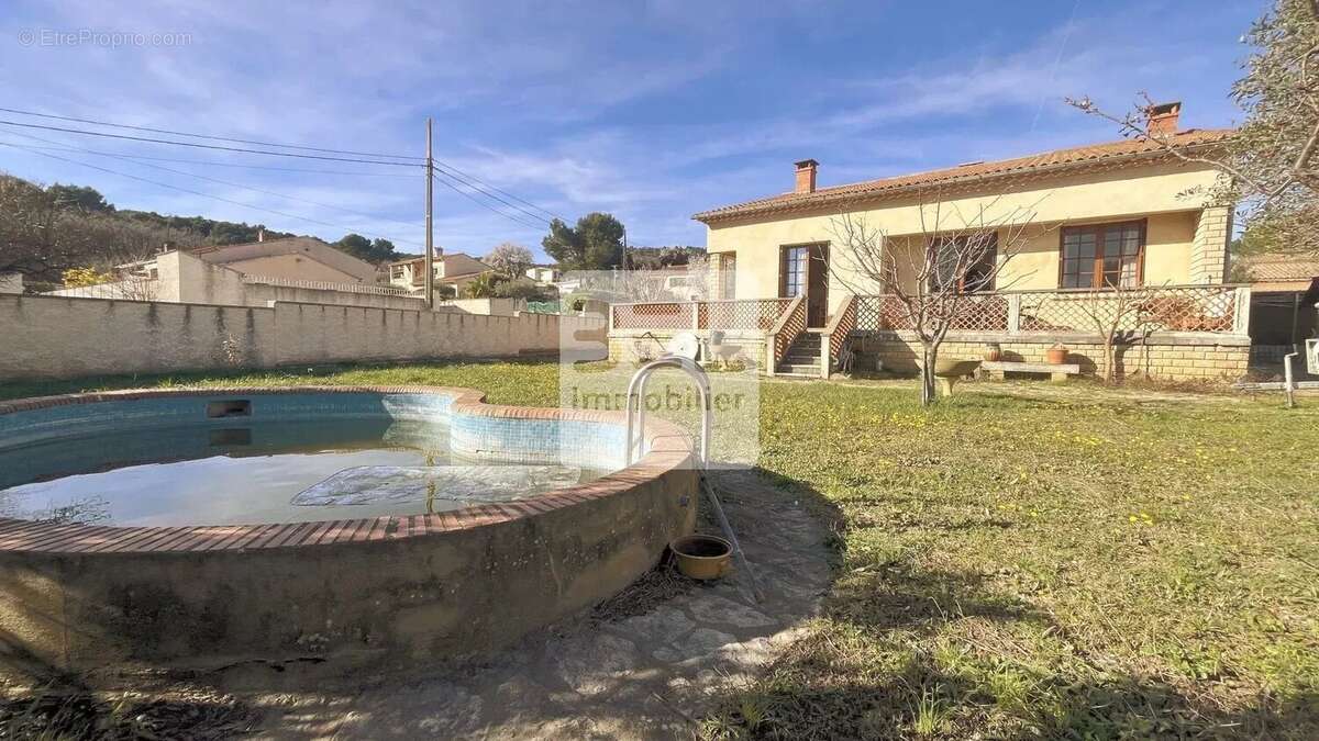Maison à LAUDUN-L'ARDOISE