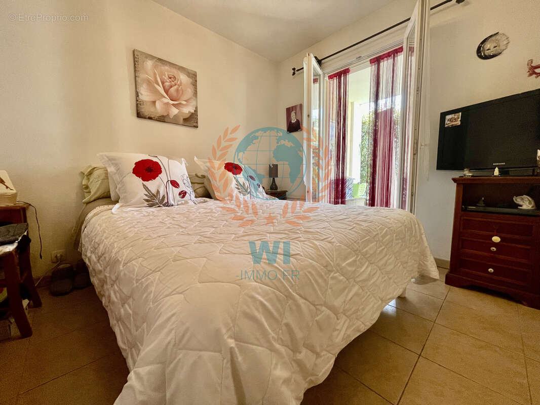 Appartement  en rez-de-jardin avec piscine et garage - photo 5
