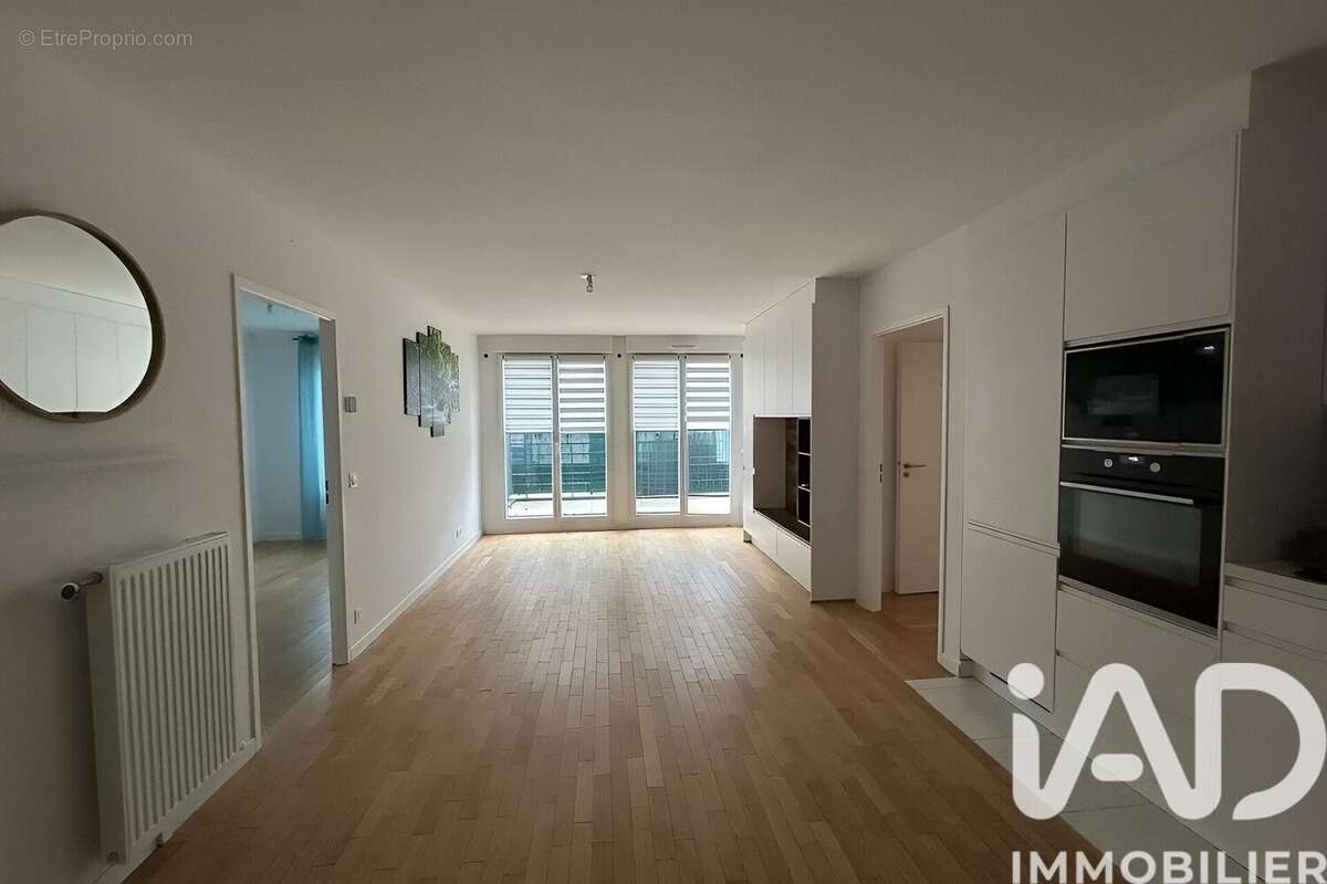 Photo 2 - Appartement à VOISINS-LE-BRETONNEUX