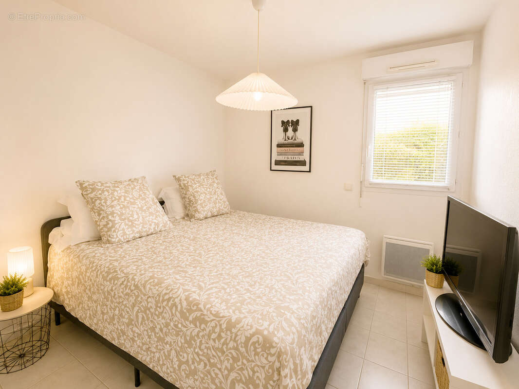 Appartement T3 en rez de jardin de 62 m2 + garage dans résidence de standing - photo 9