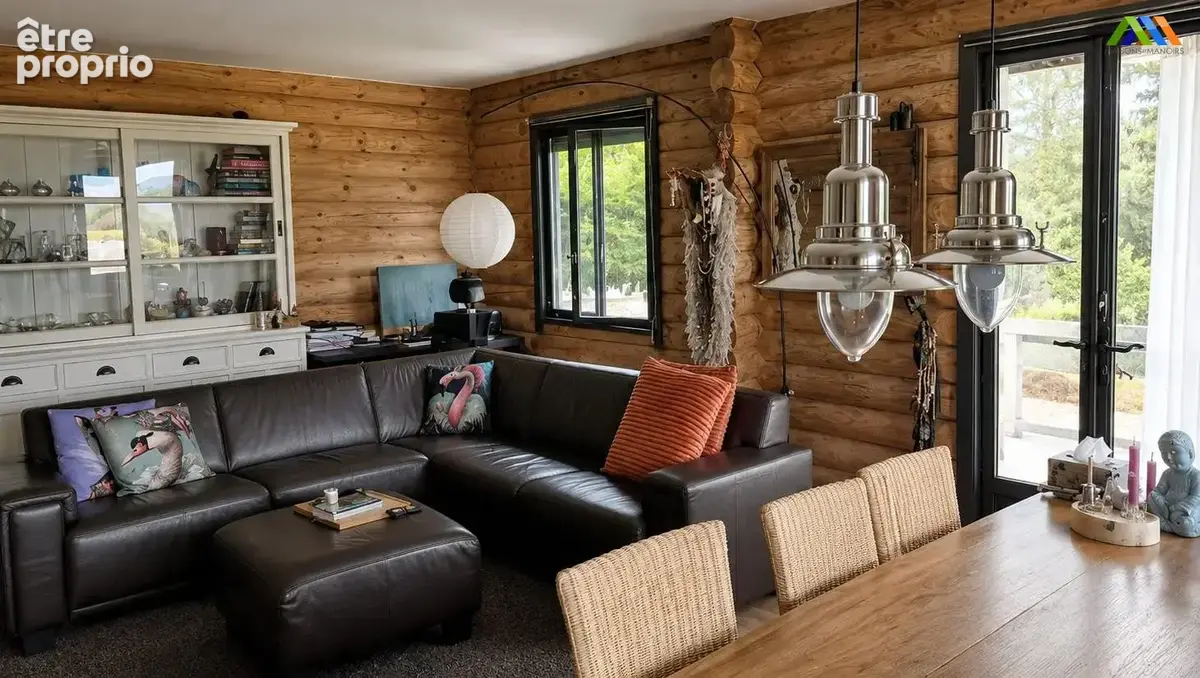 Bright and welcoming open-plan living and dining room in a characterful wooden chalet