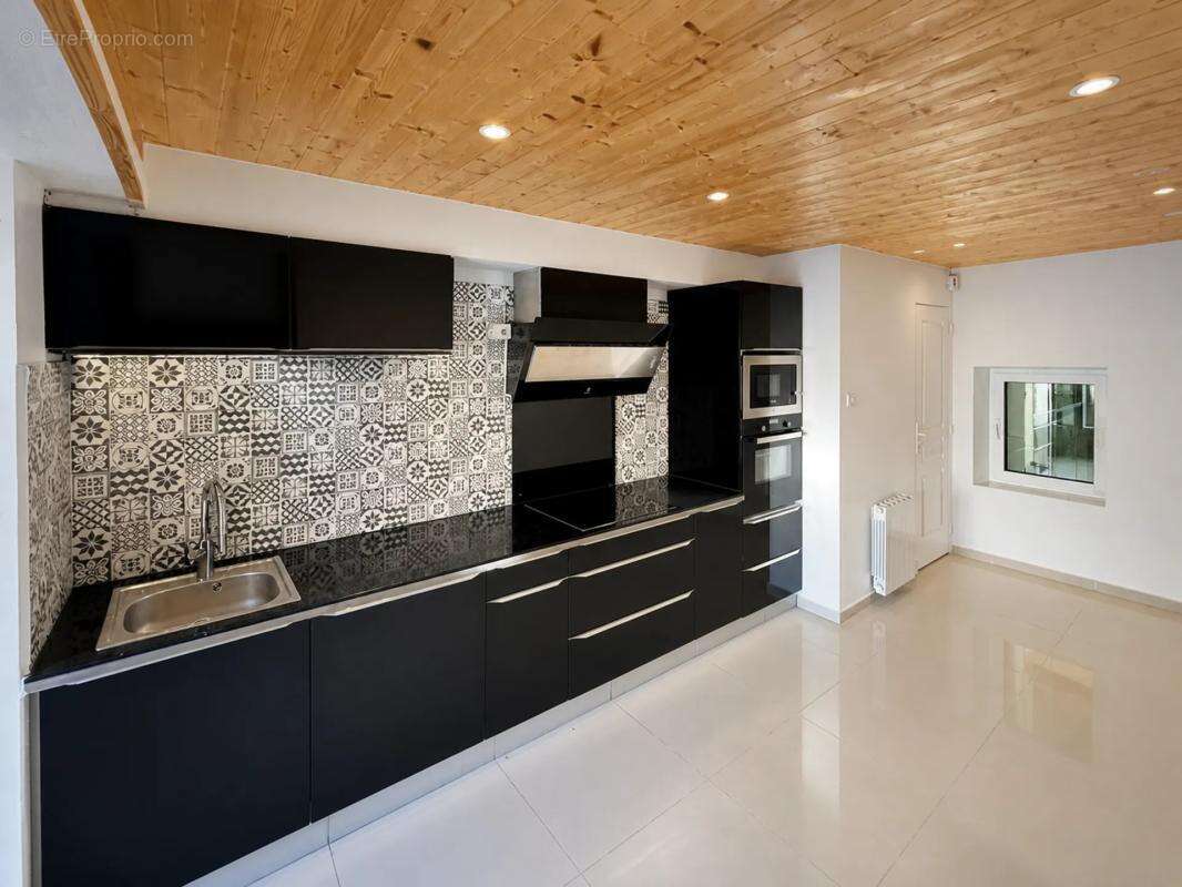 Maison de 4 pièces de 95 m² à Plussulien - photo 6