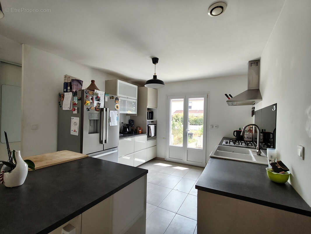 CHARVIEU-CHAVAGNEUX   Maison de plain-pied de 103 m2 avec garage sur 677 m2 de terrain - photo 4
