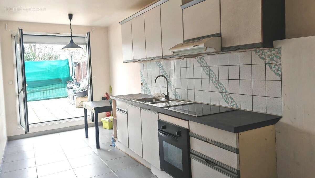 Appartement T4 au RDC avec terrasse 50 m²- Proche transport RER - photo 4