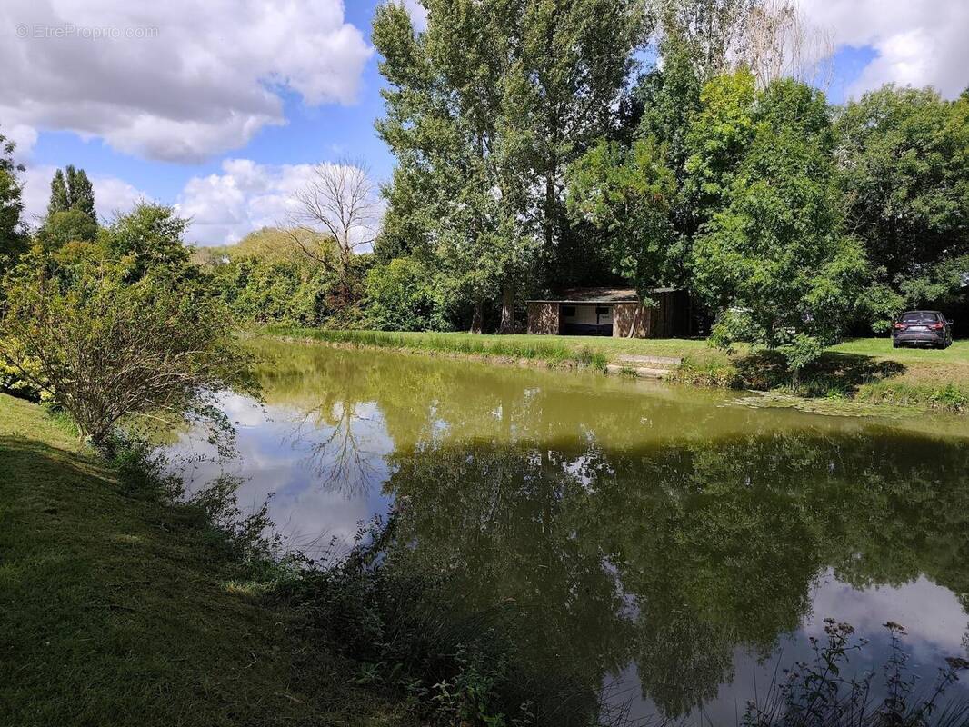 Photo 1 - Terrain à SAINT-GENOU