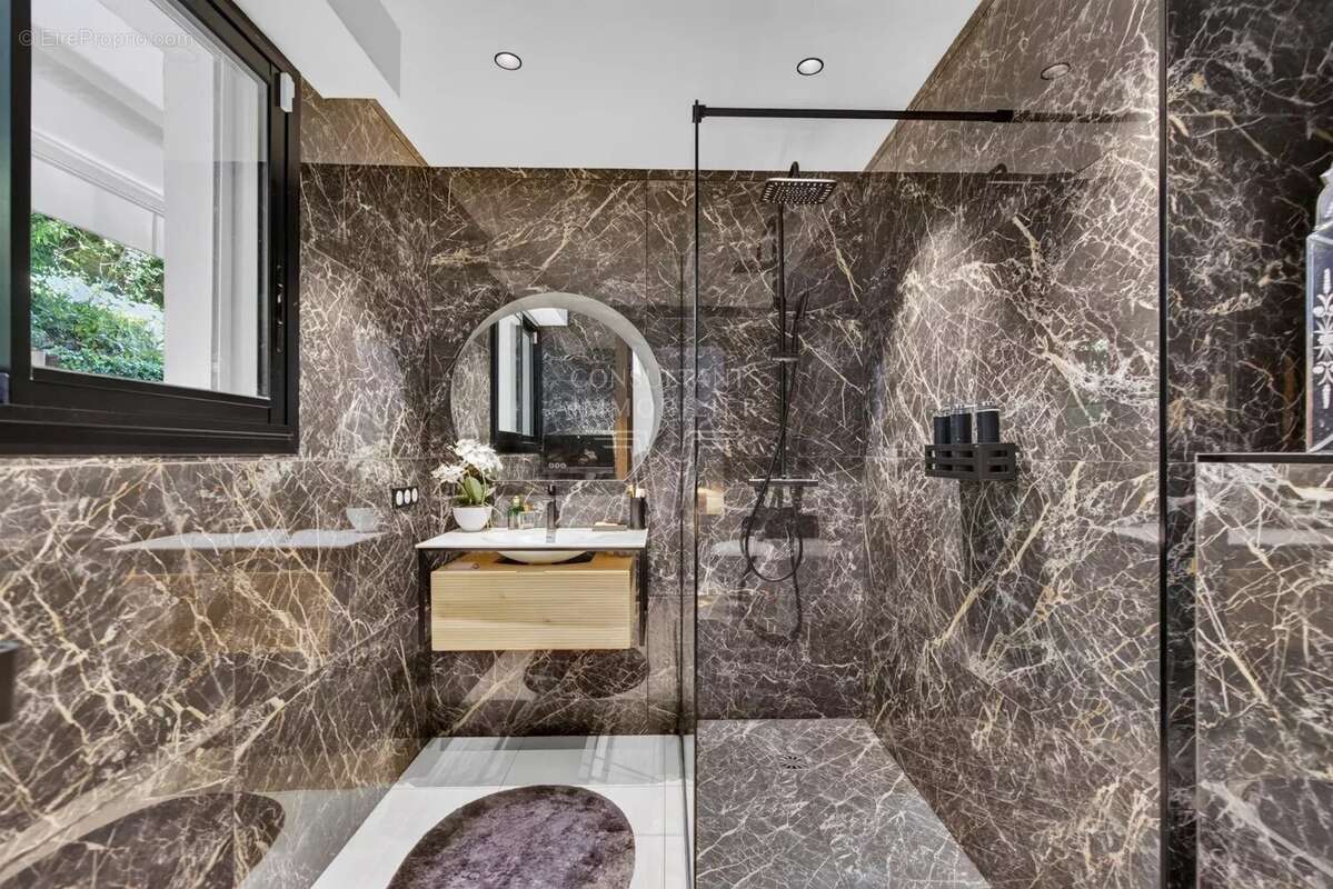 Appartement d'exception en rez-de-jardin. - photo 12