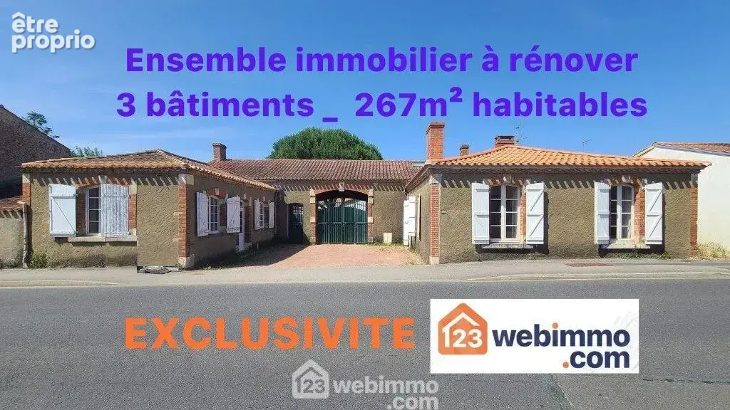 Façade rue de l'ensemble immobilier, bureau 29m² à gauche, maison de 104m² habitables à droite.