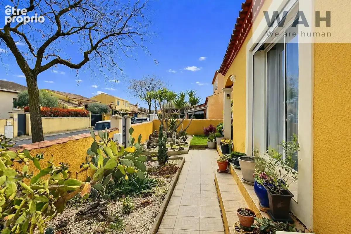 Maison de plain-pied 110 m2 avec jardin arboré et garage. - photo 2