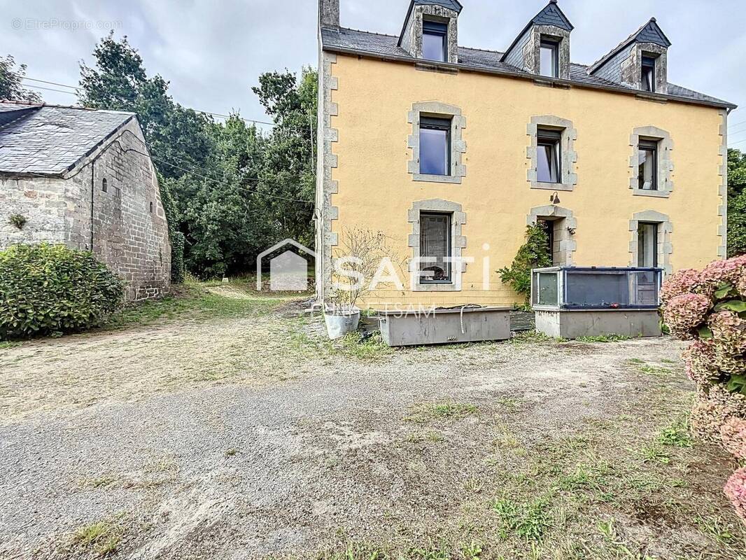 Photo 1 - Maison à PLUGUFFAN
