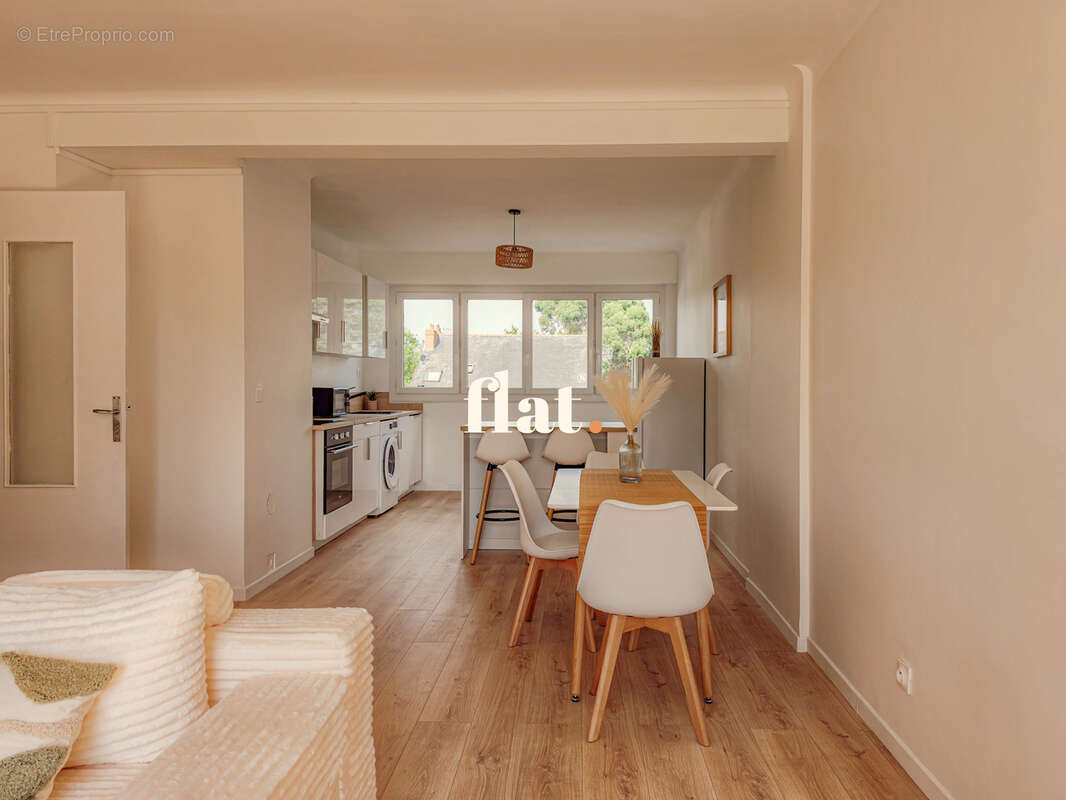 Appartement T3 de 70 m2  - RD POINT DE VANNES - 2 chambres + Cave - photo 5
