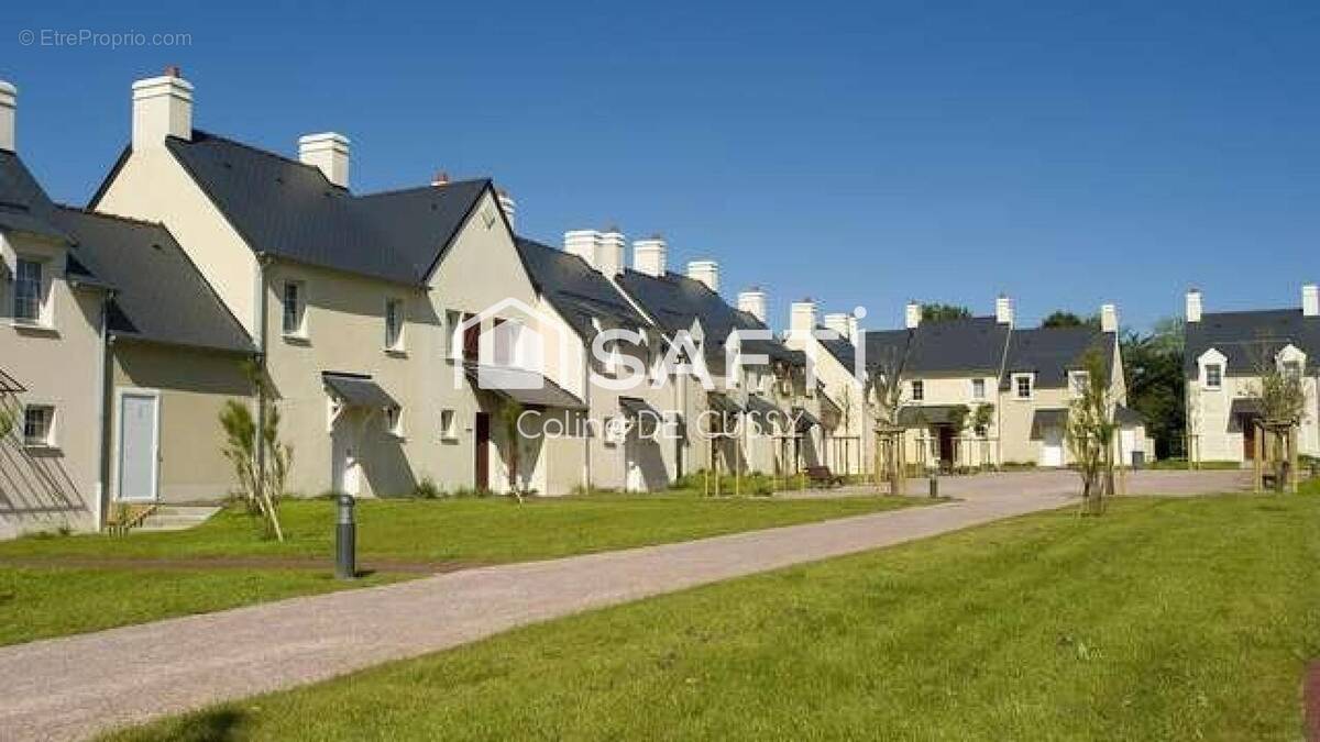 Photo 1 - Maison à PORT-EN-BESSIN-HUPPAIN