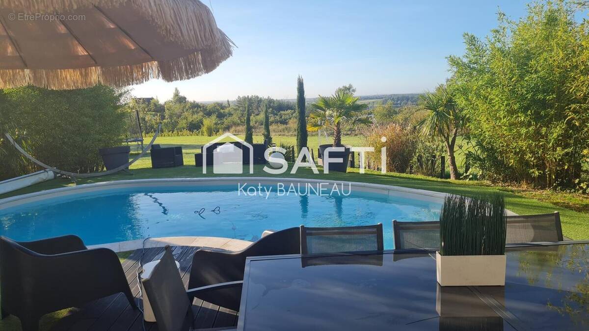 Photo 1 - Maison à BEAULIEU-SUR-LAYON