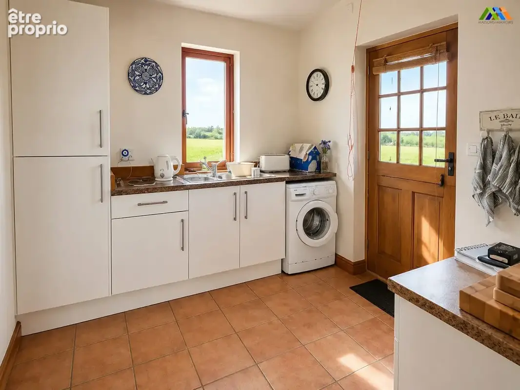 Practical laundry room in Miélan countryside bungalow