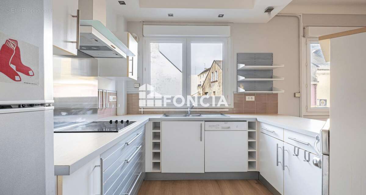 Centre ville - APPARTEMENT T3 avec balcon et caveau - photo 4