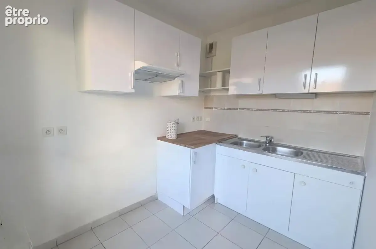 Appartement lumineux en rez-de-jardin avec place de parking - photo 3