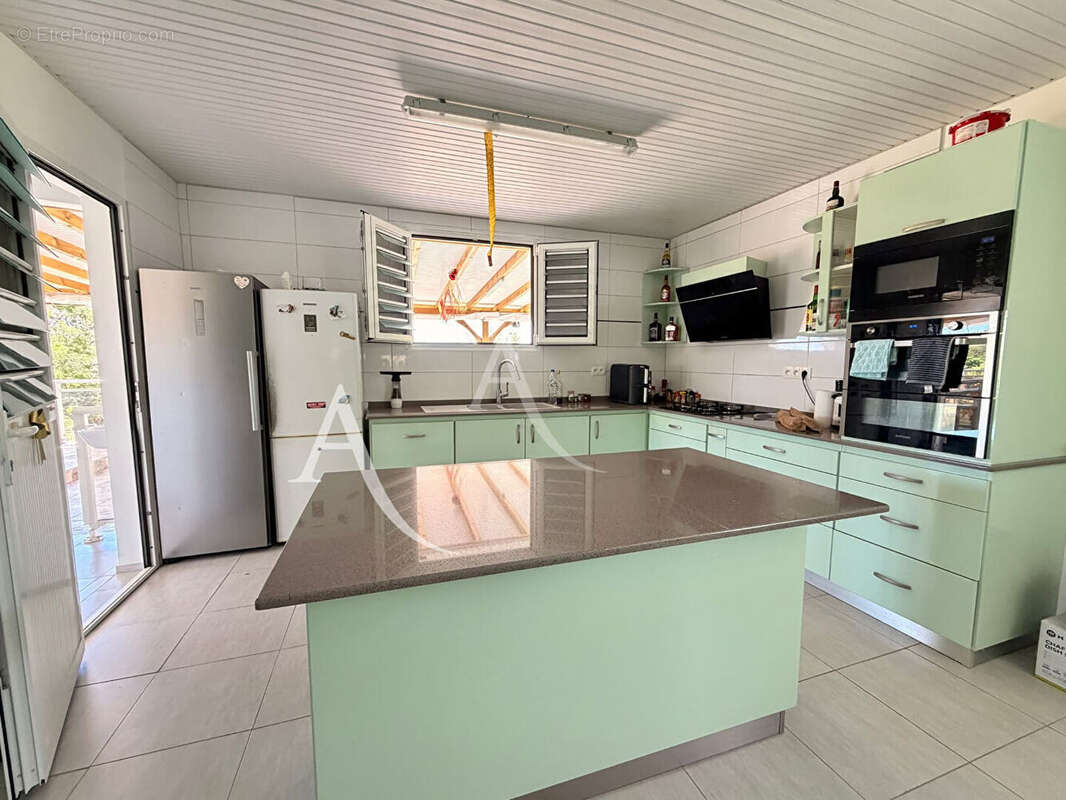 En EXCLUSIVITE: maison T4 + dépendance avec piscine au VAUCLIN. - photo 6
