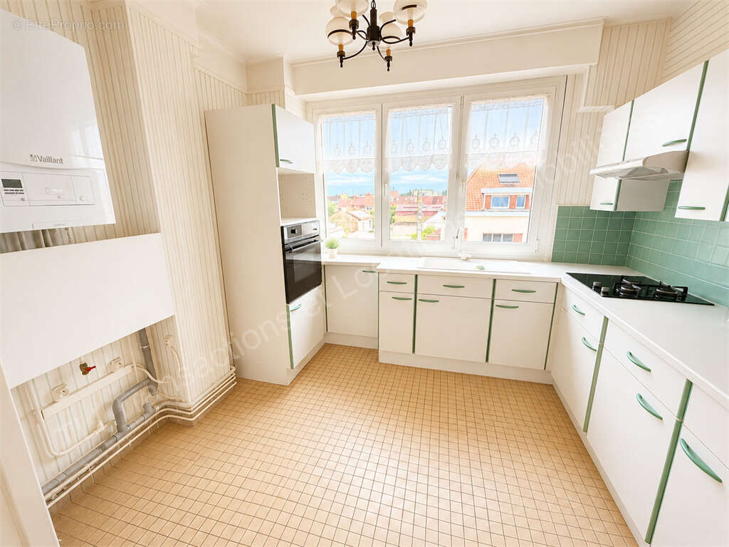 Appartement F4 de 106 m² avec balcon, garage et dépendances - photo 4