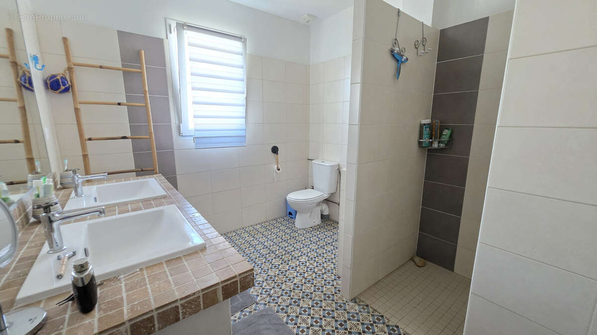 Maison de plain-pied au calme   3 chambres, garage et terrain clos de 437 m2 - photo 10
