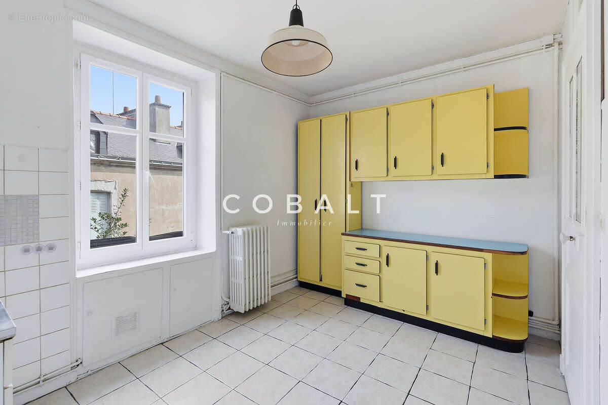 À deux pas du marché Talensac, un appartement de caractère à réinventer - photo 4