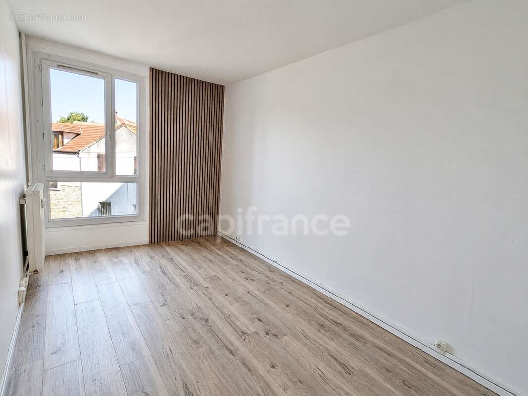 Appartement F3 avec loggia et parking - proche commerces et gare - photo 7