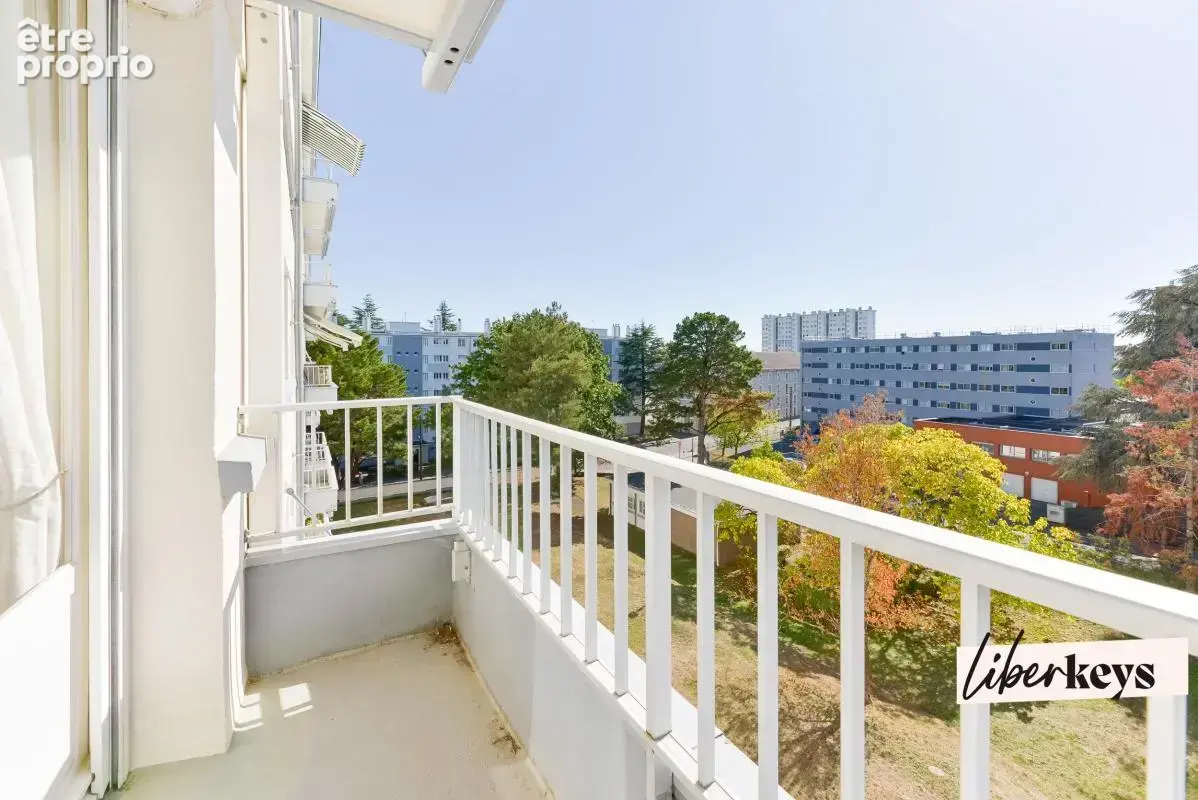 Appartement T4 de 77 m² avec balcon, cave et parking équipé - photo 3