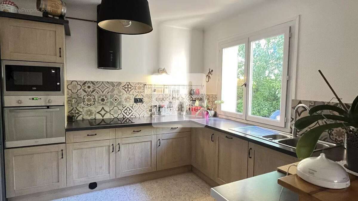 Maison à LAUDUN-L'ARDOISE