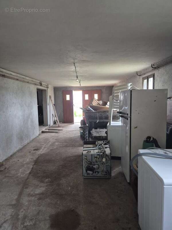 Maison de plain pied avec sous sol semi enterré - photo 8
