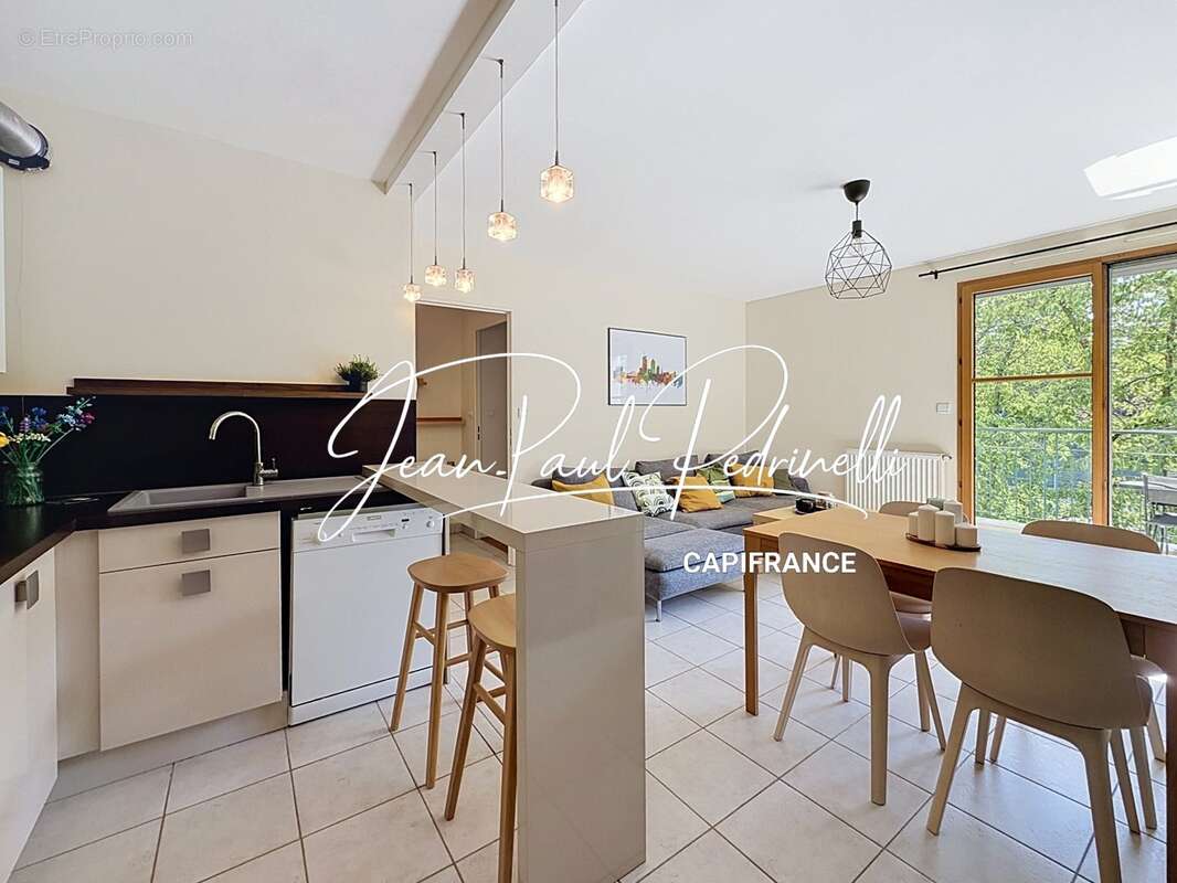 Tassin-la-Demi-Lune - Appartement 2 pièces de 48 m² avec balcon, parking privatif et cave - résidence sécurisée récente - photo 8