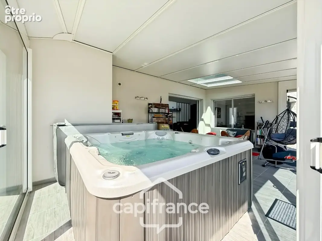 Maison contemporaine de plain-pied de 160 m² – 4 chambres – Véranda de 27 m² avec spa – Double garage – Carport – Noyal-Pontivy - photo 15