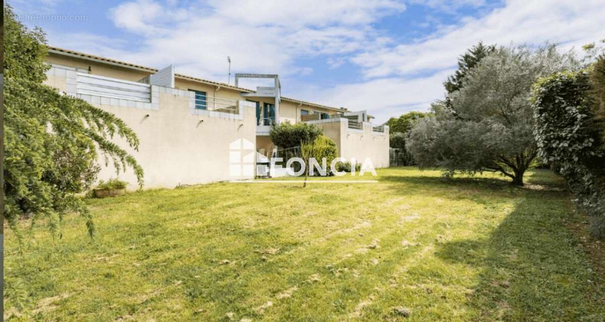 Muret sud t2 avec terrasse et parking - photo 6