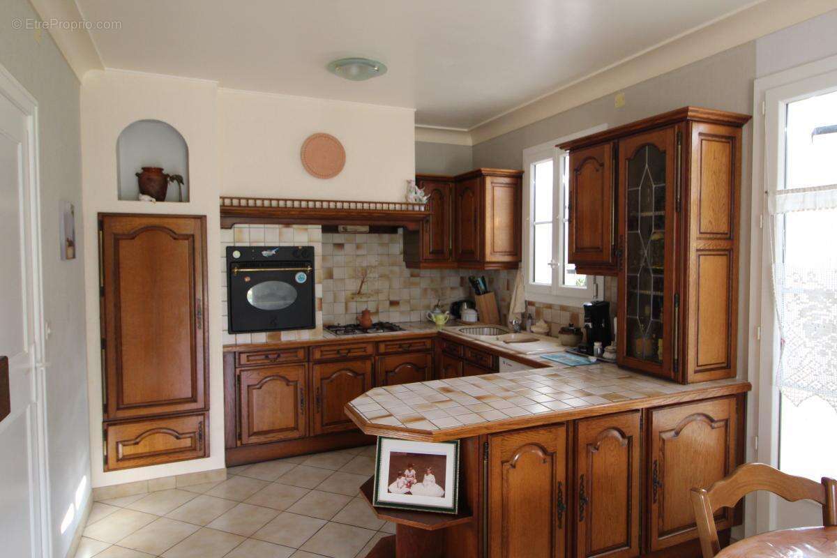 Maison sur deux niveaux avec sous sol - photo 5